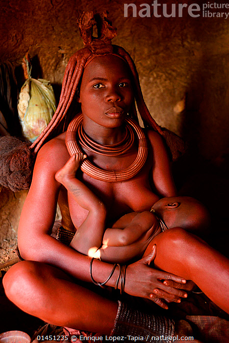 Stock Photo Of Himba Woman Breastfeeding Her Baby Inside Her Hut