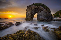 Coastal rock arch at sunset, Bermagui, New South Wales, Australia