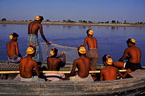 Fishermen wearing masks to protect from tiger attack. Sunderband, W Bengal, India. Tigers attack by biting back of neck, mask with prominent eyes intended to mislead and prevent tiger from attacking f...