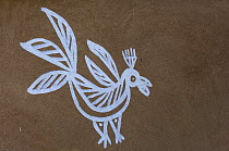 Traditional painting of bird on mud wall of house during Diwali festival, Bada Gaire Killa village, South of Tonk, Rajasthan, India