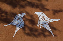 Traditional painting of birds on mud wall of house during Diwali festival, Bada Gaire Killa village, South of Tonk, Rajasthan, India