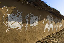 Traditional painting of plants and animals on mud wall of house during Diwali festival, Bada Gaire Killa village, South of Tonk, Rajasthan, India