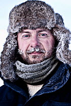 Head portrait of photographer Uri Golman in temperatures of -40 degrees celsius, with frost in his beard. Greenland. March 2009. Model released