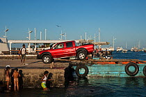 New cars being unloaded at the docks, imported from the mainland, Puerto Ayora, Santa Cruz Island, Galapagos Islands, April 2008
