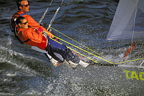 Peter Johnstone steering the One design hobiecat 14 from the wire off Newport, Rhode Island, USA.