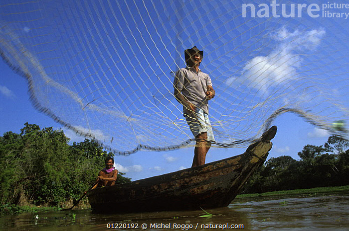 Stock photo of Caboclo man throwing fishing net. Curicaca, , Brazil,  1993.. Available for sale on