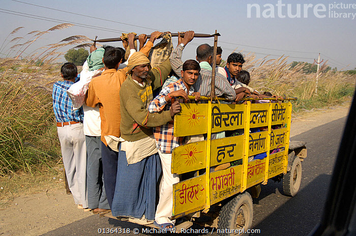 Stock photo of Typical rural transport, overloaded van with people,  Maharashtra, India. Available for sale on