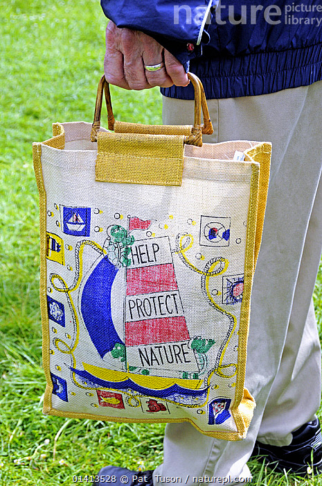 Stock photo of Man holding reusable cotton bag London UK