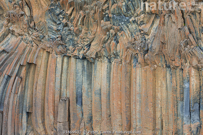 Stock photo of Patterns created from basalt columns in rock face