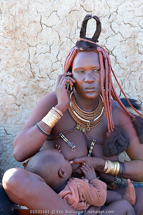 tribe breasts Stock photo of Himba woman with traditional hair and jewellery, breast  feeding whilst on…. Available for sale on www.naturepl.com