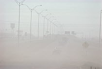 Highway and traffic obscured by dust storm, Lubbock, Texas