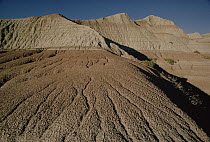 Barren, sedimentary hills eroded by wind and weather, Badlands National Park, South Dakota