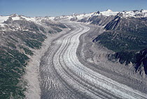 Glacier flowing between the Chigmit Mountains showing glacial valley, medial and lateral moraines, Lake Clark National Park and Preserve, Alaska