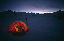 Tent with skis and snowshoes on Ruth Glacier, Denali National Park and Preserve, Alaska