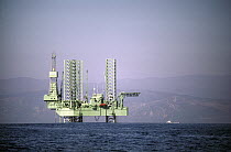Drilling platform and supply boat, Santa Barbara Channel, California