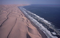 Sand dunes meet Atlantic Ocean, Skeleton Coast, Namib Desert, Namibia
