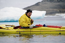 Bowhead Whale (Balaena mysticetus) researcher Kerry Finley listening to whales, Isabella Bay, Baffin Island, Canada