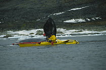 Bowhead Whale (Balaena mysticetus) researcher Kerry Finley in kayak beside whale, Isabella Bay, Baffin Island, Canada