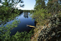 Canoe tied up at lake edge, Boundary Waters Canoe Area Wilderness, Minnesota