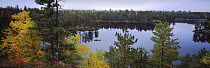 Tourist canoeing on lake, Boundary Waters Canoe Area Wilderness, Minnesota