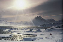 Traveler in icy landscape, Antarctica