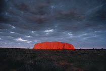 Ayers Rock under stormy sky, Uluru-Kata Tjuta National Park, Northern Territory, Australia