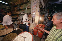 Bob Macy and Ted Papenfuss buying supplies for field work at Kerman Bazaar, Iran