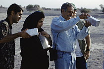 Mammal collectors line up to show Jim Patton their captured rodents, Shadad, Iran