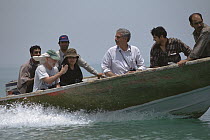 Jim Patton and Sheda with Iranian mammologist Houshang Ziaie in boat on way to mangrove swamps, Hara protected area, Iran