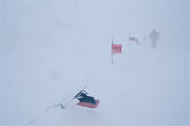 Research scientist makes his way through blizzard, US base at McMurdo Station, Antarctica