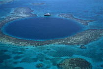 Aerial of Blue Hole, a popular dive site, and coral reef, Belize