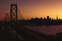 San Francisco and the Oakland-San Francisco Bay Bridge at sunset, California