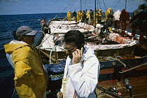 Atlantic Bluefin Tuna (Thunnus thynnus) harvest called mattanza with owner of the tuna fishery making a call to report the catch harvested, Sardinia, Italy