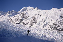 Hiker at upper Fox Glacier in winter, Westland National Park, South Island, New Zealand