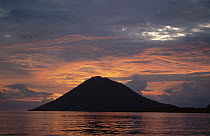 Sunset clouds around the silhouette of Manado Tua Volcano, Manado, North Sulawesi, Indonesia