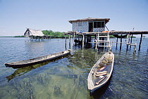 Traditional houses on stilts made by the sea gypsies, a seafaring culture of people, Manado, North Sulawesi, Indonesia