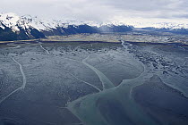 Aerial view of the Copper River Delta mudflats, where each year thousands of shorebirds stop to feed and rest during their spring migration to northern breeding grounds, Alaska