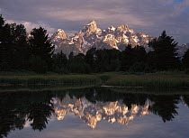 Grand Teton Range and cloudy sky at Schwabacher Landing, reflected in the water, Grand Teton National Park, Wyoming