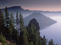 Wizard Island in the center of Crater Lake, lake fills a 6-mile wide caldera created by the eruption and collapse of Mt Mazama 7,000 years ago, Crater Lake National Park, Oregon