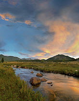 Sunset over river and peaks in Moraine Park, Rocky Mountain National Park, Colorado