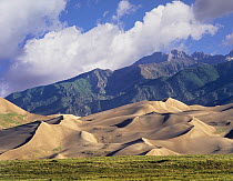 Sand dunes with Sangre de Cristo Mountains in the background, Great Sand Dunes National Park and Preserve, Colorado
