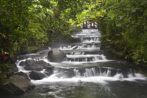Tabacon River, cascades and pools in the rainforest, Costa Rica