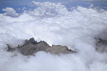 Aerial view of Mt Kinabalu shrouded in clouds, Borneo, Malaysia