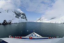 Ship with tourists in Lemaire Channel, Antarctica