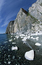 White marble Sagan-Zaba cliff along shoreline of Lake Baikal showing darker cherry (Black) cliff behind, Pribaikalsky State National Park, Russia