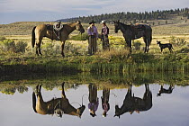 Domestic Horse (Equus caballus) group with cowboy and cowgirl, Oregon