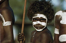 Groote Eylandt villagers preparing for Corroboree dance wearing face paint, Gulf of Carpentaria, Australia