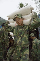 Soldiers delivering rice after the May 12, 2008 earthquake and landslides, CCRCGP, Wolong, China