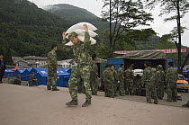 Soldiers delivering rice after the May 12, 2008 earthquake and landslides, CCRCGP, Wolong, China