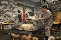 Workers making bamboo bread for pandas after the May 12, 2008 earthquake and landslides, CCRCGP, Wolong, China